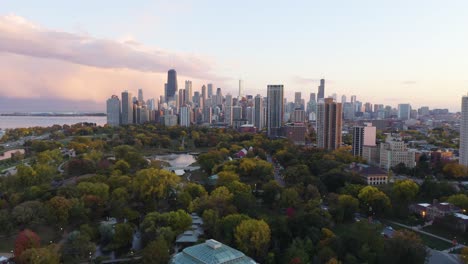 Aerial-Establishing-Shot-of-Lincoln-Park-and-Chicago-Cityscape---Autumn-Sunset