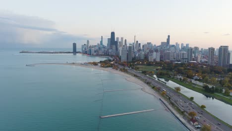 Aerial-Shot-of-Lake-Michigan-and-Chicago-Cityscape---Colorful-Autumn-Sunset