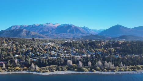 Observing-the-autumn-textures-of-the-city-of-Bariloche-surrounded-by-its-grandiose-mountains-and-Nahuel-Huapi-Lake,-Patagonia-Argentina