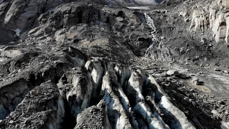 Aerial-flyover-over-the-crevasses-of-the-Tiefen-glacier-in-Uri,-Switzerland