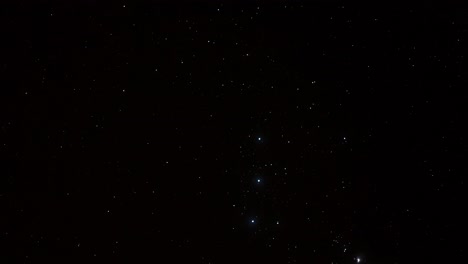 Dark-night-time-lapse-of-the-orange-luminous-star-Betelgeuse-and-the-Hunter,-Orion-constellation