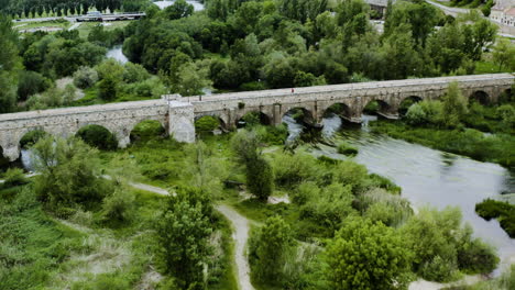 People-Crossing-Tormes-River-Through-Roman-Bridge-Of-Salamanca-In-Spain