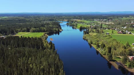 Calm-Waters-Of-The-Lake-With-Lush-Vegetation-In-Appelbo,-Dalarna,-Sweden---aerial-drone-shot