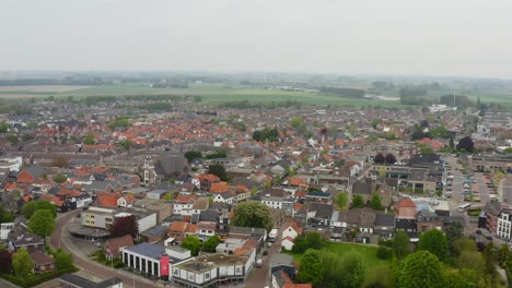 Aerial-backward-flight-over-the-downtown-of-Axel-city-in-the-Netherlands