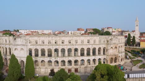 Aerial:-beautiful-ancient-Roman-Pula-Arena-amphitheatre,-Pula-city,-Croatia