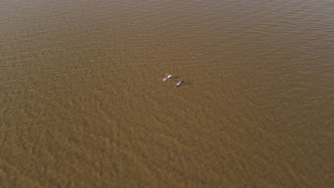 Kayaking-boat-adventure-diaries-at-murky-amazon-river-aerial