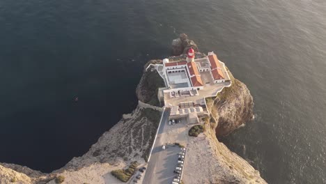 Lighthouse-and-convent-overlooking-Atlantic-Ocean,-Cabo-de-Sao-Vicente,-Sagres,-Algarve