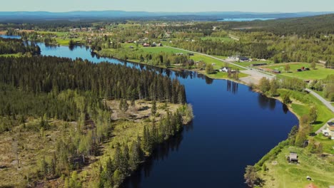 Countryside-Landscape-With-Coniferous-Forest-And-Calm-Lake-Water,-Appelbo,-Dalarna,-Sweden---aerial-shot