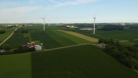 Beautiful-Establishing-Shot-of-Wind-Turbines-on-Rural-Farm-in-America