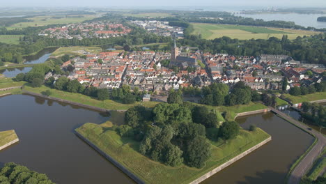 Flying-away-from-a-beautiful-Dutch-town-with-a-large-church-in-the-center