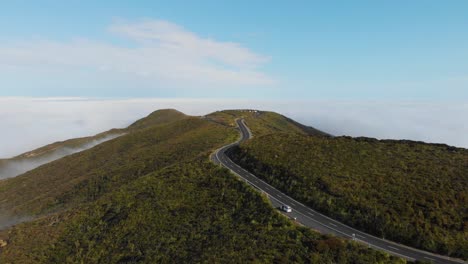 Drone-shot-of-empty-road-high-in-the-hills-leading-to-the-famous-Cape-Reinga-New-Zealand-on-a-sunny-summer-morning-in-4K