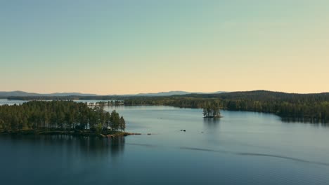 Aerial-View-Of-Busjon-Lake,-Appelbo,-Dalarna,-Sweden-During-Daytime---drone-shot