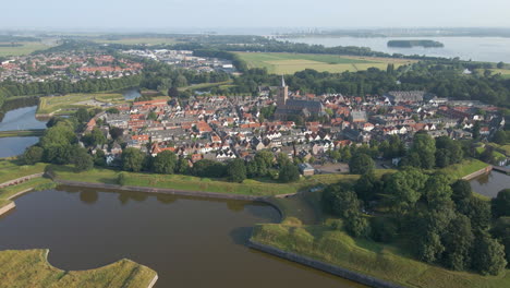 Drone-flying-away-from-the-beautiful-fortress-town-Naarden,-the-Netherlands