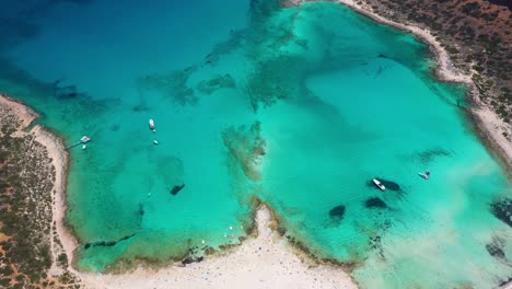 Aerial-of-Balos-Beach-and-Lagoon-with-turquoise-water,-mountains-and-cliffs-in-Crete,-Greece