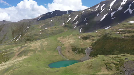 Wide-cinematic-rotating-drone-shot-of-Oreit-Lake-in-Tusheti-Georgia,-in-the-Caucasus-mountains