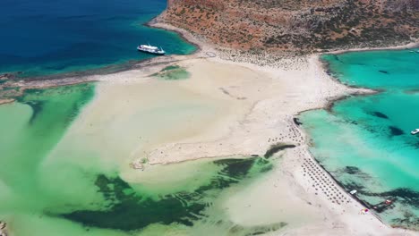 Aerial-static-view-Balos-Beach-and-Lagoon-with-turquoise-water,-mountains-and-cliffs-in-Crete,-Greece