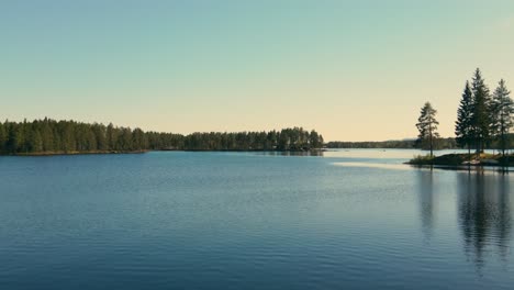 Beautiful-And-Calm-Waters-Of-Lake-Busjon-In-Dalarna,-Sweden---aerial-drone-shot