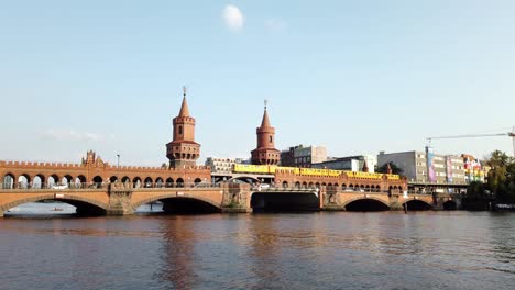 Urban-Scenery-of-Famous-Oberbaum-Bridge-in-Berlin-with-Yellow-Train