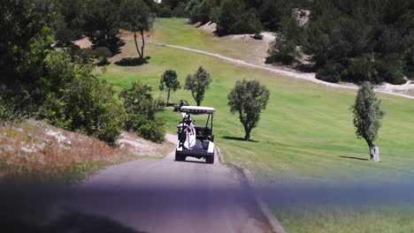 Golf-cart-cruising-at-Mallorca-Alcanada-club-Spain