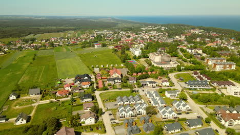 Aerial-above-coastal-town-Jastrzebia-Gora-in-Poland,-sunny-day