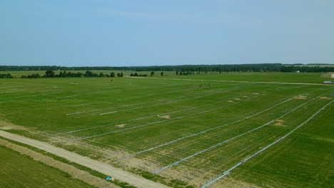 Aerial-backward---Construction-area-of-the-largest-solar-farm-in-central-europe,-renewable-energy-field-in-Zwartowo-Poland