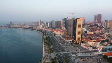 Traveling-front,-Luanda-city,-golden-hour-flying-over-Luanda-bay,-Africa-#6