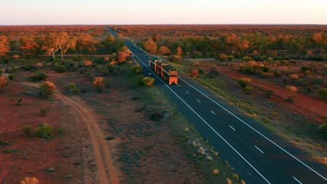Aerial-View-of-a-Road-Train-passing-by-on-Stuart-Highway---Northern-Territory,-Australia