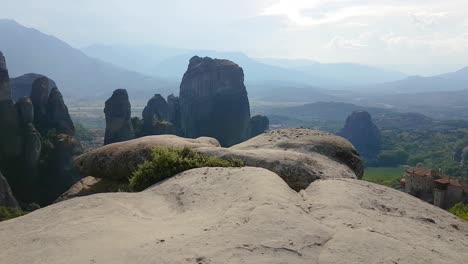 Walking-on-Sandstone-cliff-with-panoramic-view-over-Meteora-in-Greece