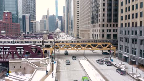 Fixed-Aerial-Shot---Subway-Train-Crossing-Busy-Street---Downtown-Chicago