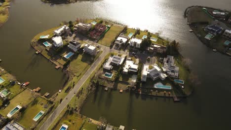 AERIAL---Beautiful-houses-on-a-lake,-Ingeniero-Maschwitz,-Buenos-Aires,-Argentina