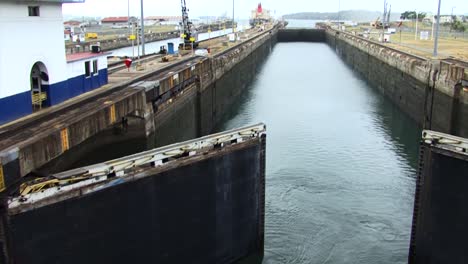 Hydraulic-Gates-slowly-opening-for-the-ship-to-pass-in-the-next-chamber-at-Panama-Canal,-Gatun-Locks
