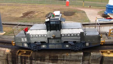 Starboard-side-electric-locomotive-pulling-the-ship-at-Gatun-Locks,-Panama-Canal