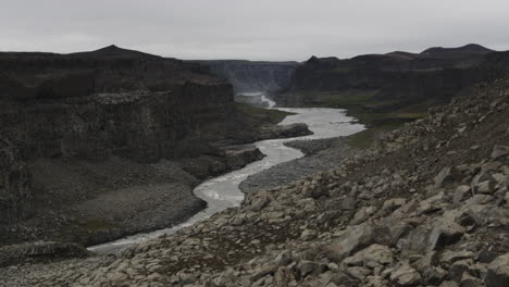 Cinematic-dolly-in-of-the-Jokulsa-a-Fjollum-river-below-the-Dettifoss-waterfalls-in-Iceland
