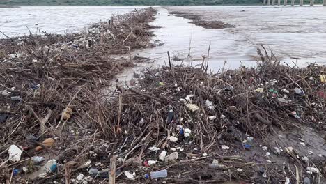 A-close-up-view-of-Plastic-bottles-in-polluted-river-water
