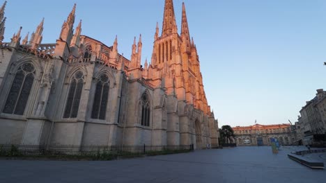 Saint-andrew-cathedral-side-wall-and-pey-berland-square-empty-during-sunrise-with-nobody,-moving-smooth-wide-shot
