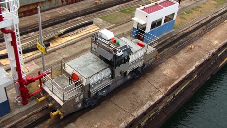 Port-side-electric-locomotive-pulling-the-ship-thru-the-Gatun-Locks,-Panama-Canal