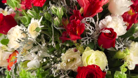 Floral-arrangement-close-up-macro-shot-red-and-white-roses-and-lily-spinning