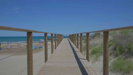 Wooden-Walkway-Path-by-Sandy-Beach-on-Spanish-Mediterranean-Coastline
