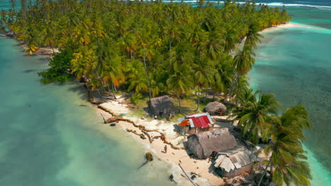 Indigenous-People's-Hut-At-Tropical-Island-With-Coconut-Trees-At-San-Blas-Islands-In-Panama