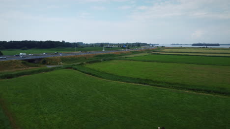 Aerial-shot-of-motorway-in-Netherlands,-rising-fom-low-altitude