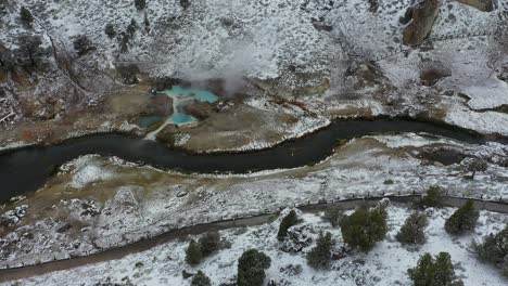 Hot-Springs-in-Winter-Landscape,-Steam-From-Geothermal-Water-and-Creek,-Mammoth-Lakes,-California-USA,-Drone-Shot