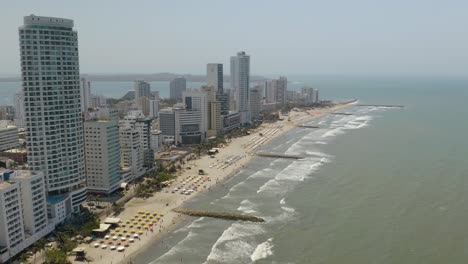 Pedestal-Down-Above-Playa-De-Bocagrande,-Cartagena's-Most-Popular-Beach
