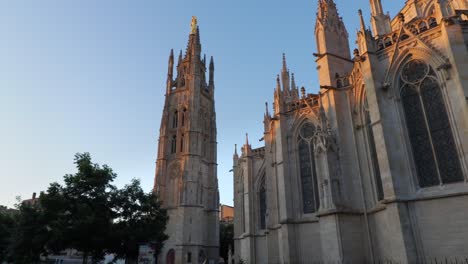Pey-berland-tower-and-saint-andrew-cathedral-in-bordeaux-during-morning-sunrise-wide-moving-shot