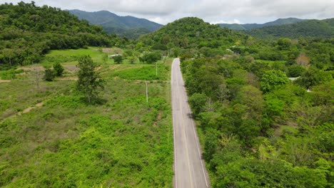Reverse-aerial-footage-of-Kaeng-Krachan-National-Park,-UNESCO-World-Heritage-site,-Thailand