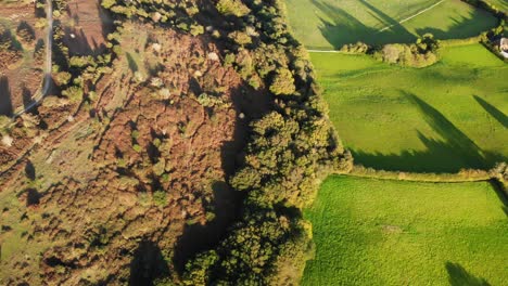 Aerial-downwards-shot-showing-beautiful-shadows-on-the-fields-and-heather-at-Fire-Beacon-Hill-Sidmouth-Devon-England