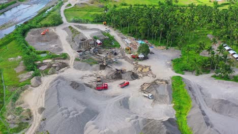 Aerial-View-Of-Gravel-Pit-With-Green-Coconut-Trees-In-The-Philippines