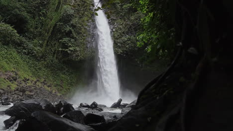 Slow-motion-shot-revealing-roaring-La-Fortuna-waterfall-during-rainy-season