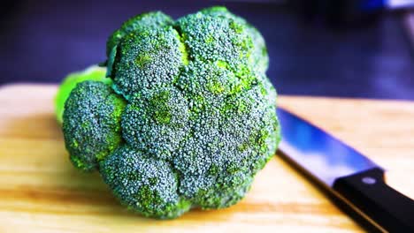Broccoli-on-Chopping-Board-with-Knife-Ready-for-Preparation-for-Cutting-and-Slicing-with-Panning-Movement-in-HD-at-60FPS