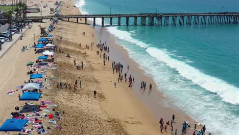 Rising-aerial-view-of-the-Balboa-pier-and-Beach,-Newport-Beach,-California