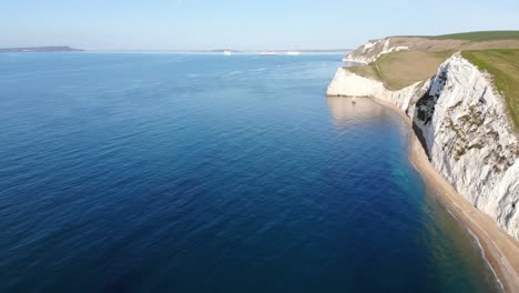 Aerial-View-Of-Calm-English-Channel-Waters-With-White-Cliffs-Near-Durdle-Door